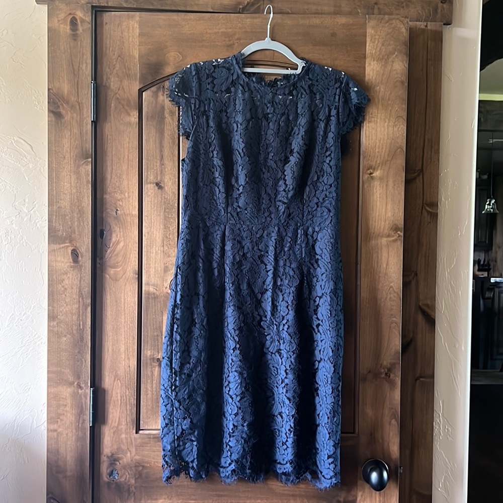 Navy blue lace dress, zipper back, cap sleeves.